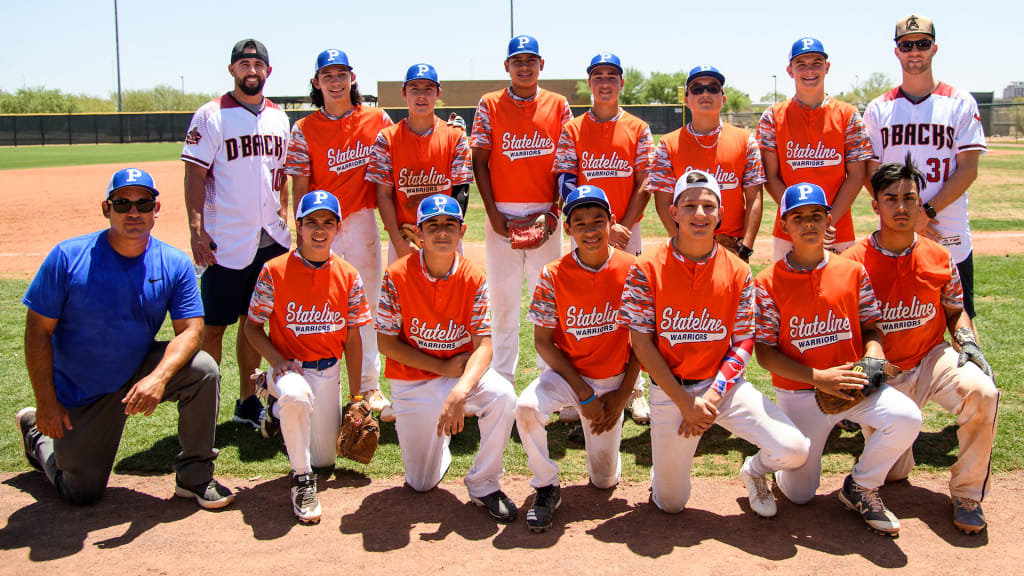 Deven Marrero and Brad Boxberger pose with one of the clubs in the Inter-Tribal Tournament at Salt River Fields.