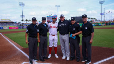 Kody Clemens and Roger Clemens exchange lineup cards